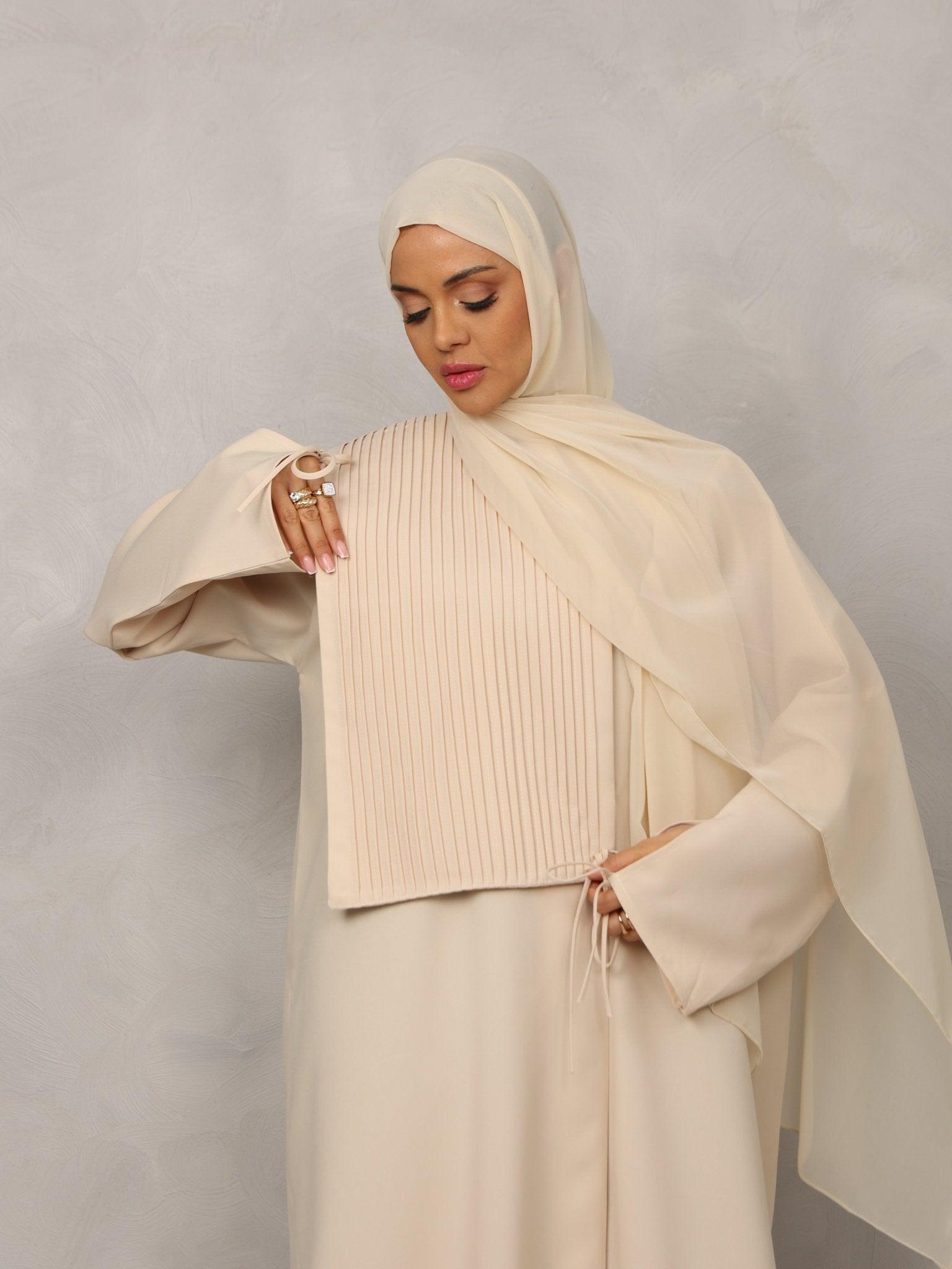 cream abaya dress Introducing our cream abaya with matching moon hijab. The abaya is crafted from high-quality crepe and does not wrinkle easily. fabric our crepe cream abaya is ideal for everyday wear as it's